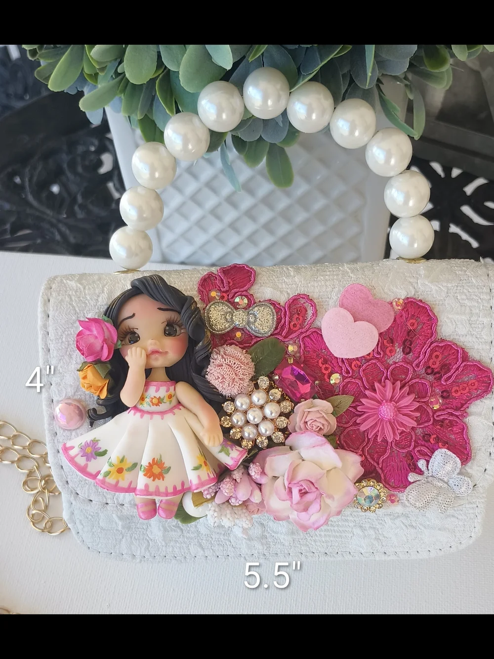 Handcrafted Pearl Handle Mini Bag With Clay Doll& Floral Applique.